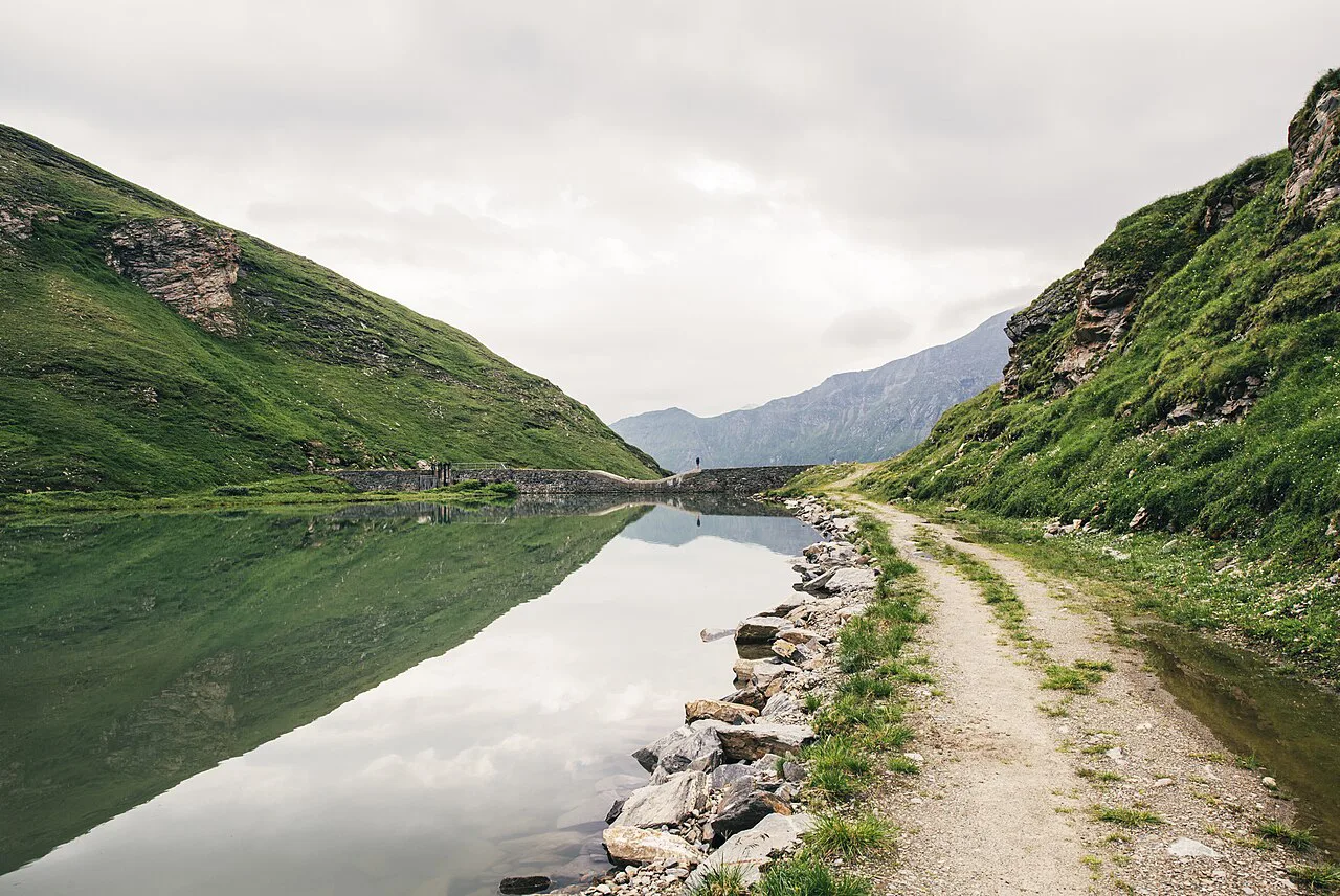 Waterfalls at Grossglockner hiker at the lake, Austria