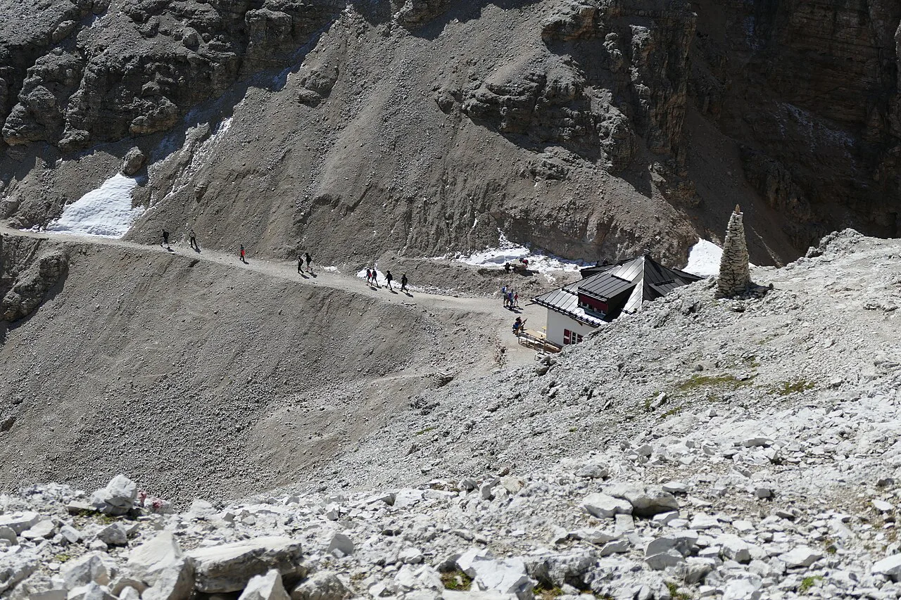 Hikers starting the climb to Piz Boè from the Rifugio Forcella Pordoi, Dolomites
